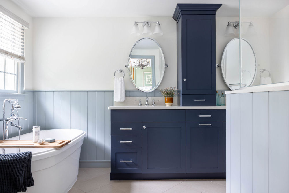 Stoneham bathroom design remodel with blue vanity and soaking tub