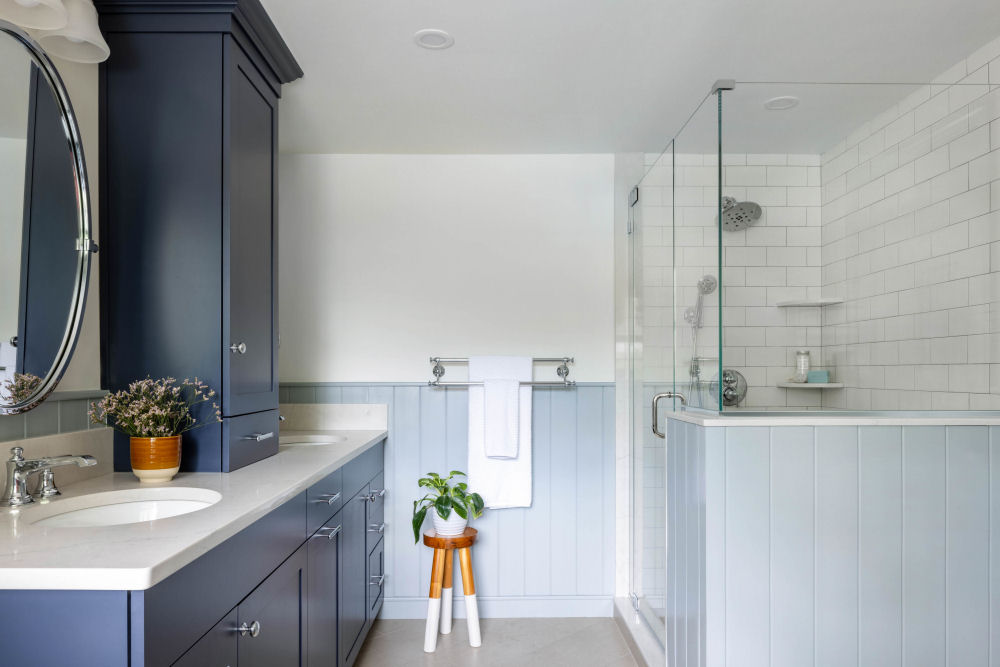 Stoneham bathroom design remodel with blue vanity and custom shower