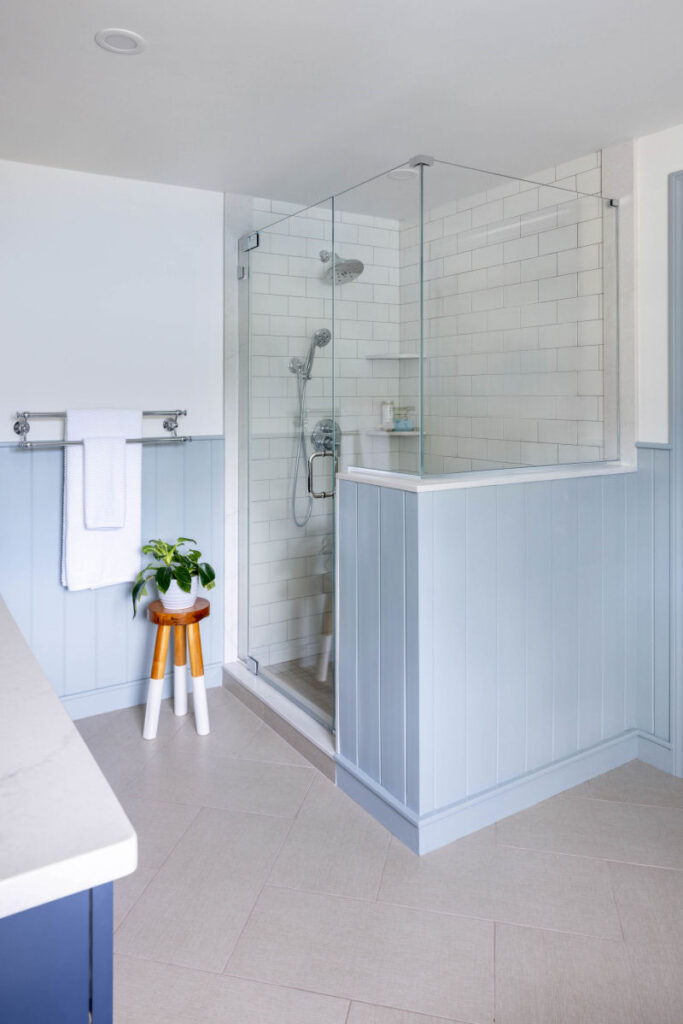 Stoneham bathroom design remodel with blue vanity and custom shower
