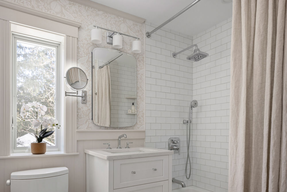 Malden Bathroom Design and Remodel with white subway tiles and white vanity