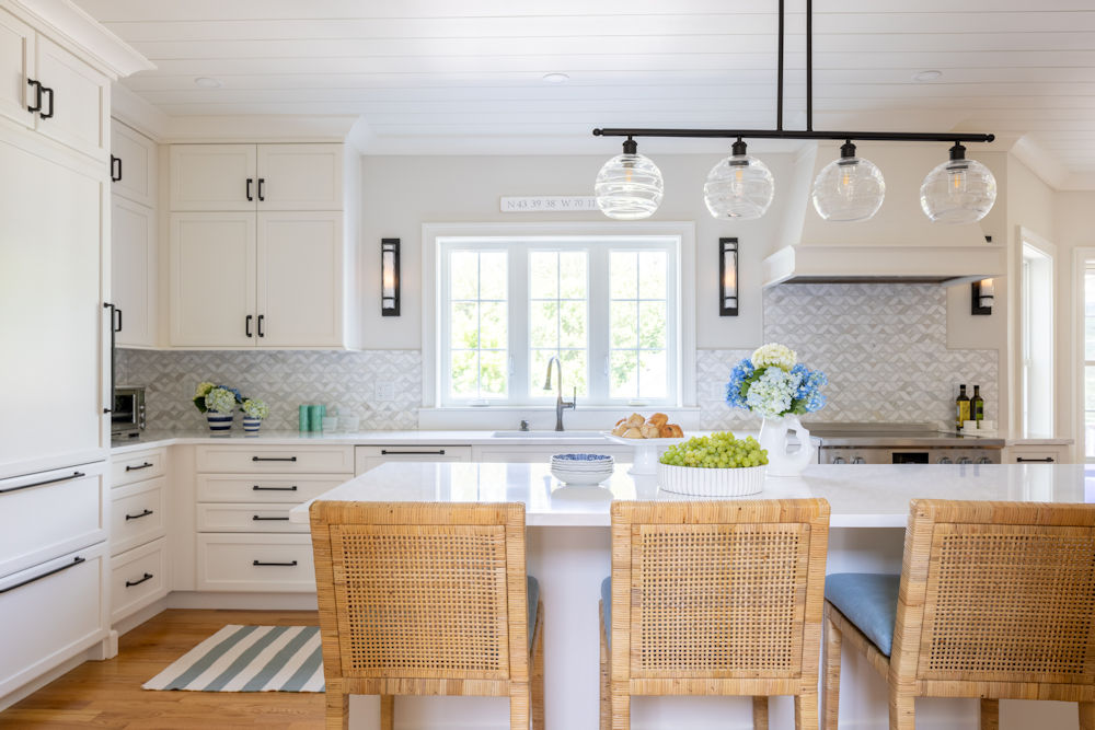 North Reading kitchen design and remodel with white cabinetry and shiplap ceiling - McGuire + Co. Kitchen & Bath