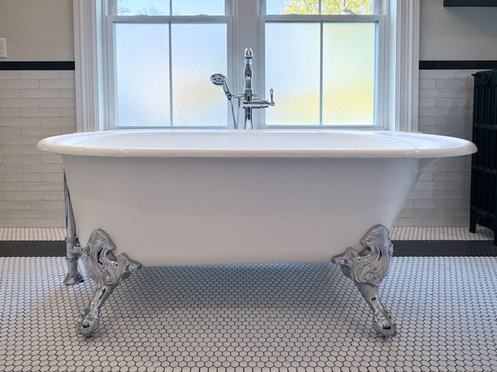 Bathroom remodel with clawfoot soaking tub and free standing tub filler - McGuire + Co. Kitchen & Bath