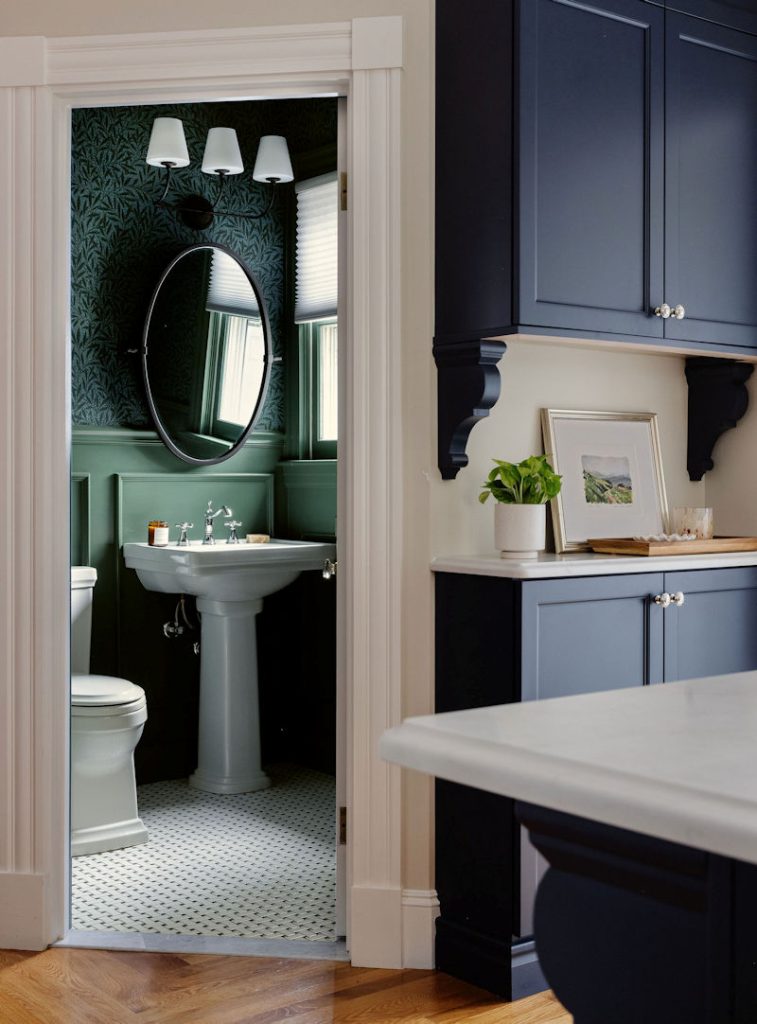 Wakefield victorian powder room remodel design build project with a pedestal sink and green wallpaper