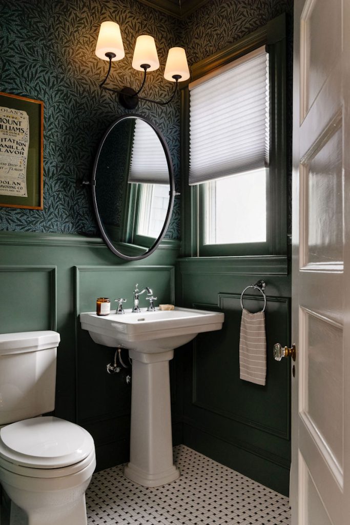 Wakefield victorian powder room remodel design build project with a pedestal sink and green wallpaper