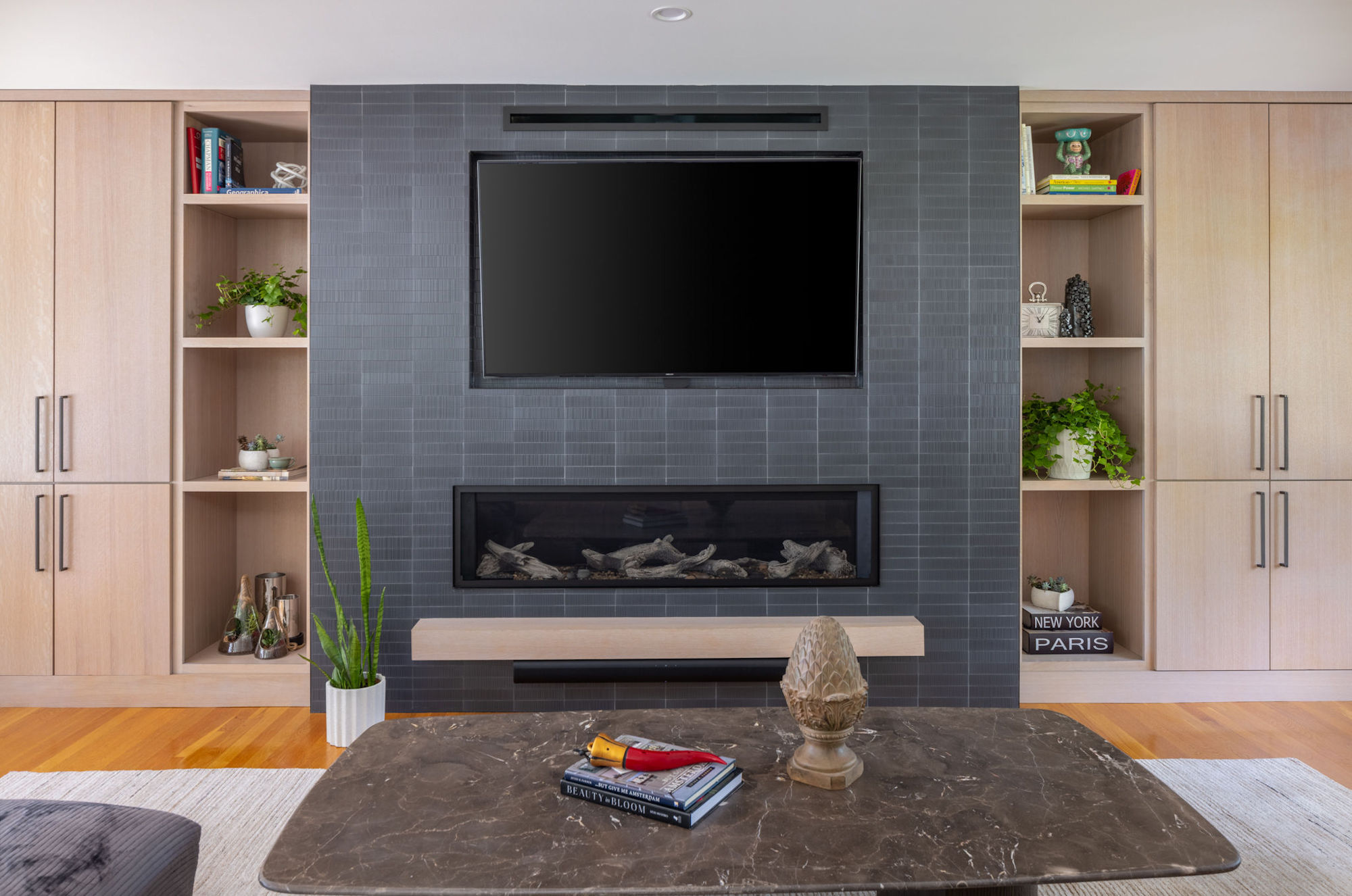 Lynnfield living room cabinetry and black tile fireplace surround