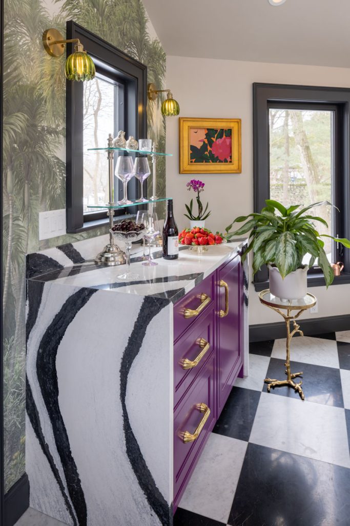 Melrose design-build project with salon breezeway raspberry cabinetry with bold black and white quartz countertop.