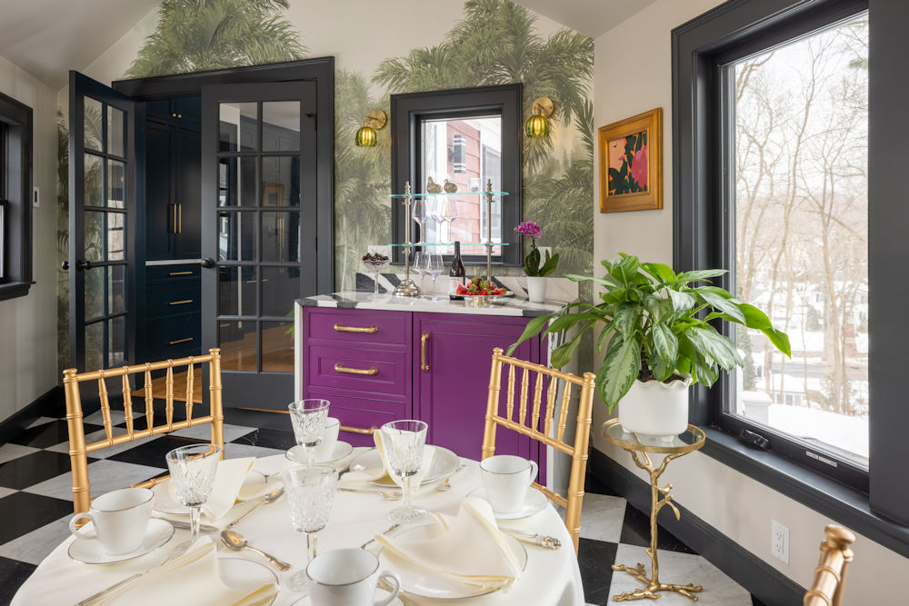 Melrose design-build project with salon breezeway raspberry cabinetry with bold black and white quartz countertop and palm tree wallpaper