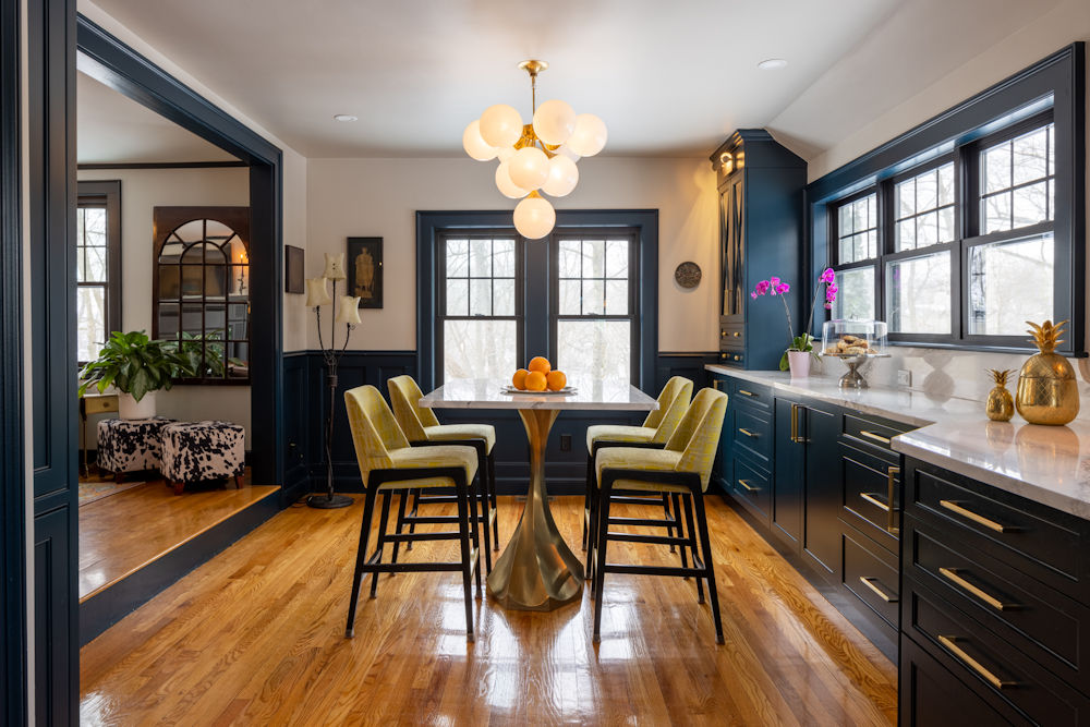 Melrose kitchen and dining area with deep blue cabinety and quartz countertop